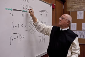 Fr. Denis teaching mathematics (2010)