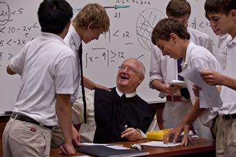 Fr. Denis shares a laugh with his math students (2010).