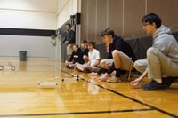 Senior Physics Mousetrap Cars: The second quarter of senior physics is dedicated to building two competitive mousetrap cars: one speed racer and one distance racer.  Enjoy these pictures from our final set of races during our last lab period.