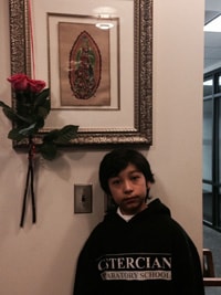 A Form I student brought roses in honor of the Feast Day of the Virgin of Guadalupe.