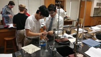 Seniors use the titration procedure to pass quantities of one solution into another solution in order to complete a reaction. They then use this information to perform calculations to learn the concentration of the solution.