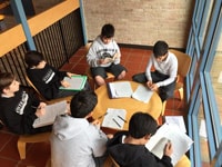 Students in Form I English in a collaborative discussion group study The Silver Chair by C.S. Lewis.