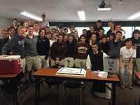 The Class of 2015 honors their chaplain, Fr. Anthony, after he delivers his last homily to them in the music room..