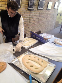 Fr. Mark making bread